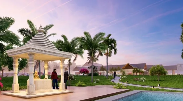A small white temple pavilion at dusk, beside a pool, with palm trees in the background.